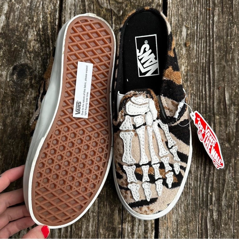 Vans Skeleton Graphic Slip-Ons in Black and Tan